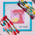 Kitchen and Coffee Stand Mixer needlepoint starter kit - 13-count stitch printed canvas with red stand mixer and yellow batter on soft pink background