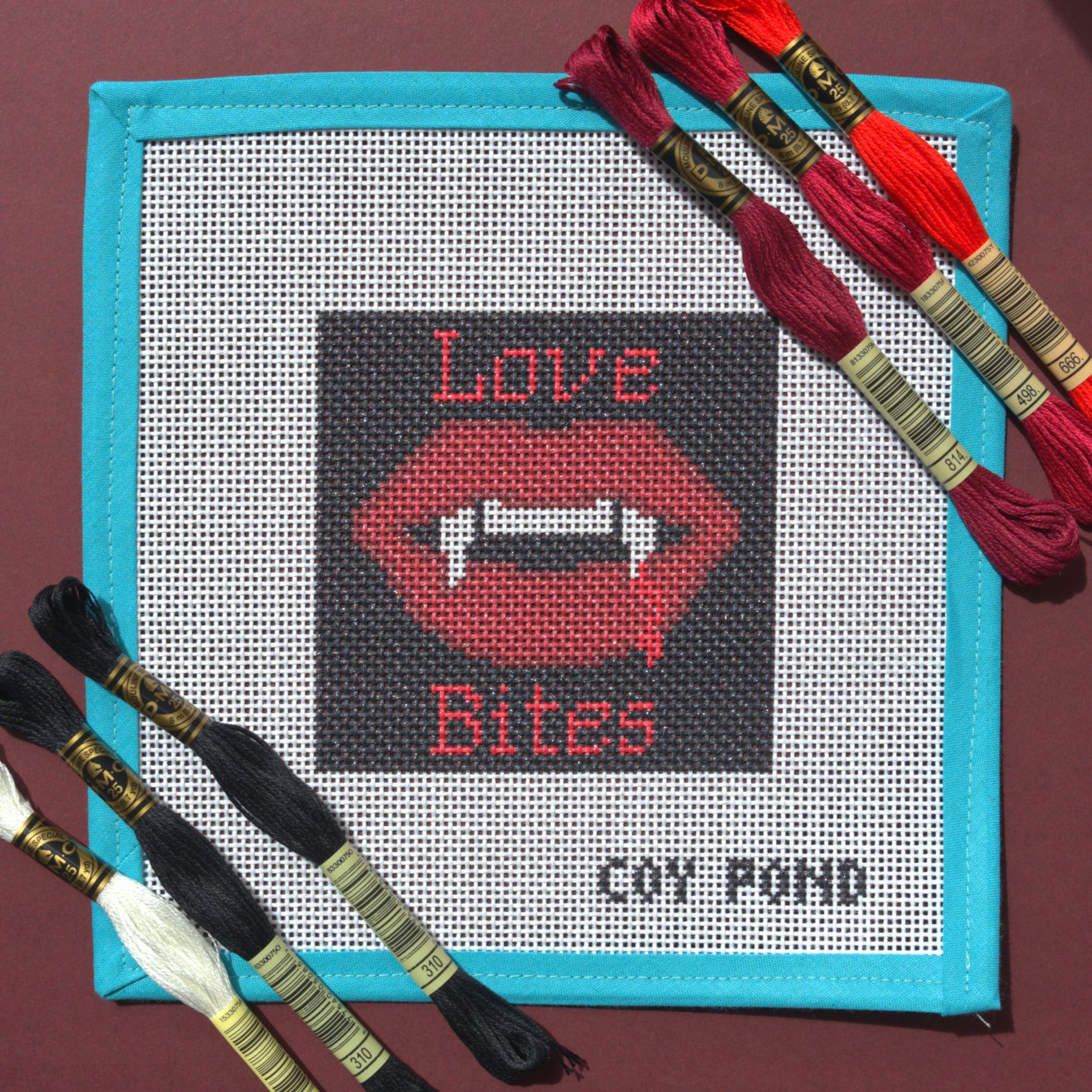Romantasy Love Bites needlepoint starter kit - 13-count stitch printed canvas with red vampire lips and fangs on black background