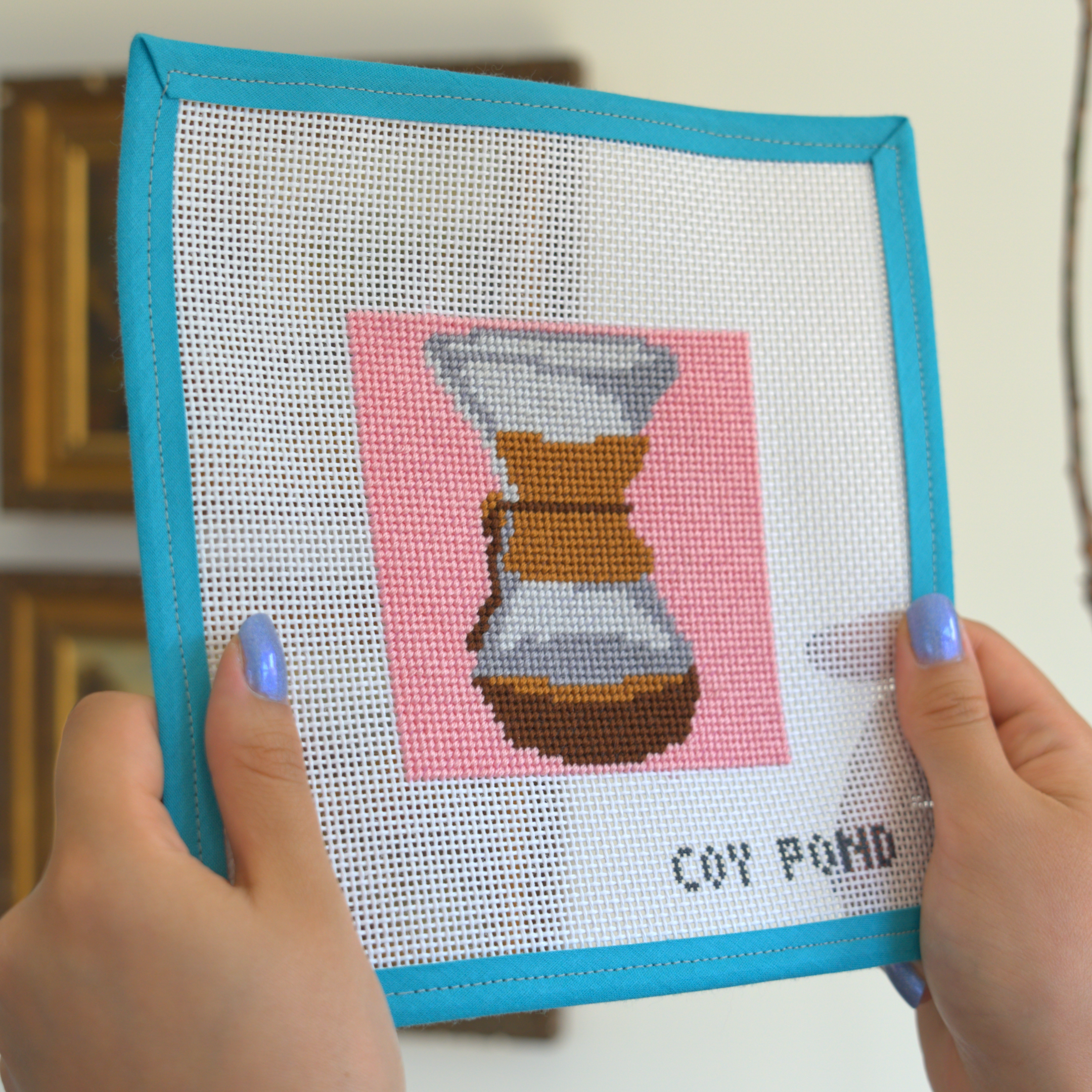 Kitchen and Coffee Hourglass Coffee Maker needlepoint kit - completed stitched canvas showing hourglass coffee maker with collar on pink background