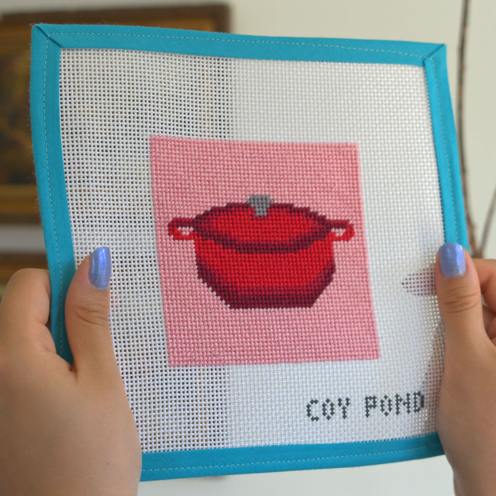 Kitchen and Coffee Dutch Oven needlepoint kit - completed stitched canvas showing red Dutch oven on pink background